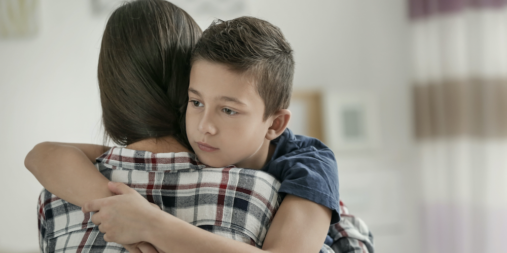 Mother hugging her child